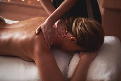 Therapist massaging a client’s back
